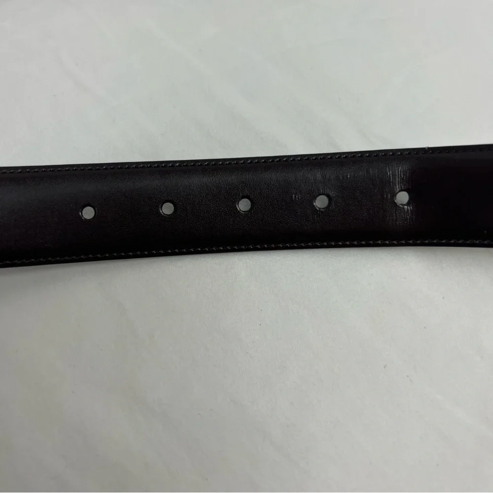 Men’s black and dark brown reversible genuine leather belt.